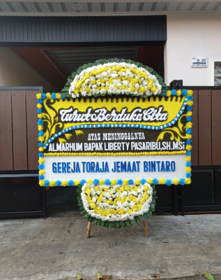 Papan Bunga Duka di Purwaharja